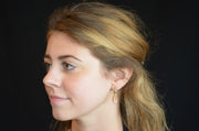 14k Yellow Gold Elegant Twisted Oval Hoop Earrings - LooptyHoops